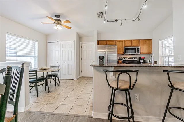 an aerial view of a house with a swimming pool outdoor seating and yard