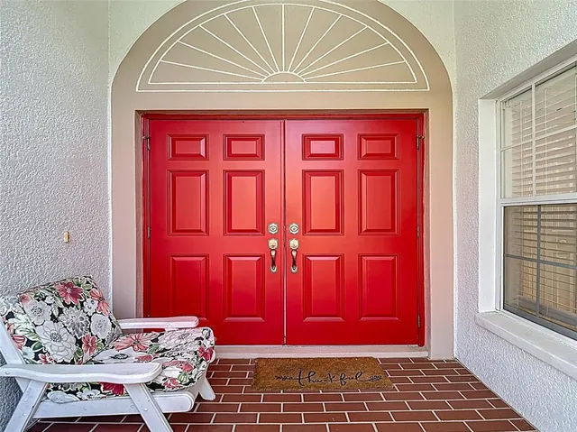 a view of hall way with furniture