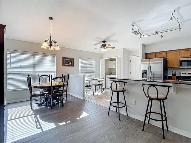 a bedroom with a bed dresser and a window