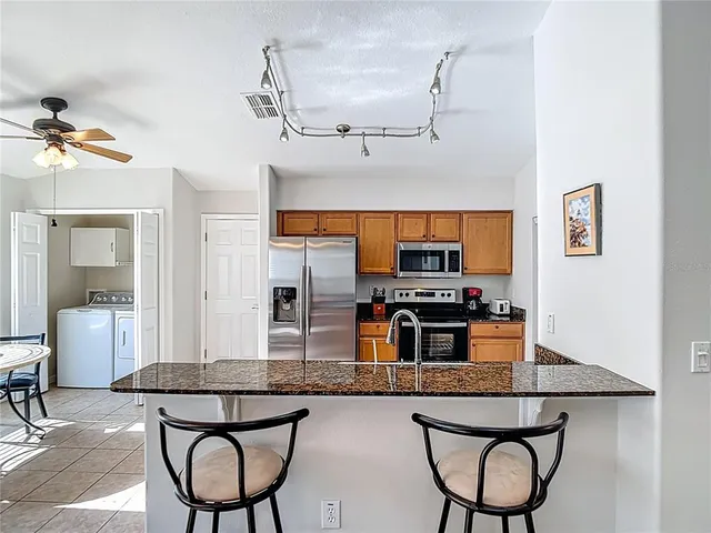 a bathroom with a sink toilet tub and shower