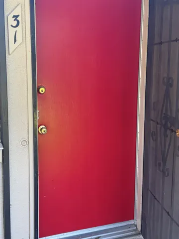 a view of wooden floor and windows in a room