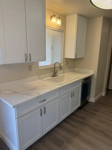 a close view of sink sitting next to a window