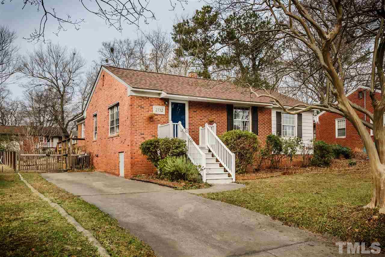 2732 Layden Street Raleigh, NC 27603 - Photo 1 of 19 a front view of a house with garden and plants