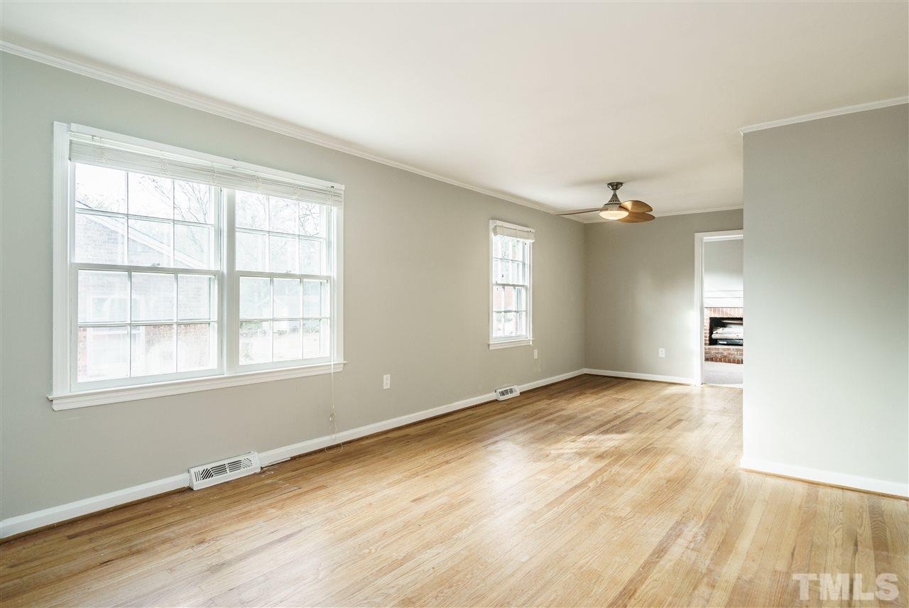 2732 Layden Street Raleigh, NC 27603 - Photo 2 of 19 an empty room with wooden floor and windows