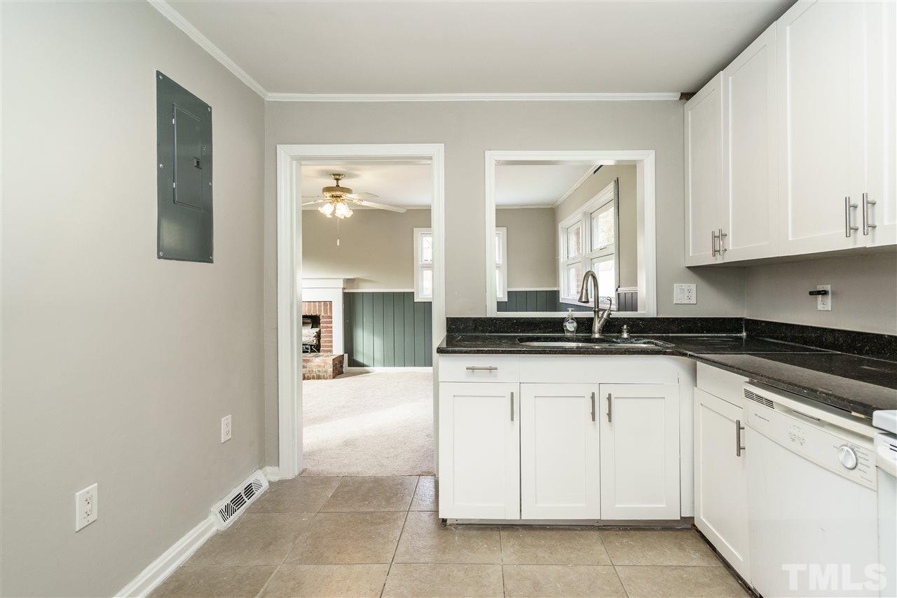 2732 Layden Street Raleigh, NC 27603 - Photo 11 of 19 a large white kitchen with granite countertop a sink