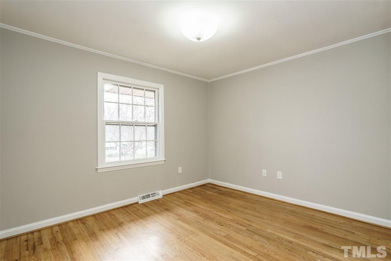 2732 Layden Street Raleigh, NC 27603 - Photo 14 of 19 an empty room with wooden floor and windows