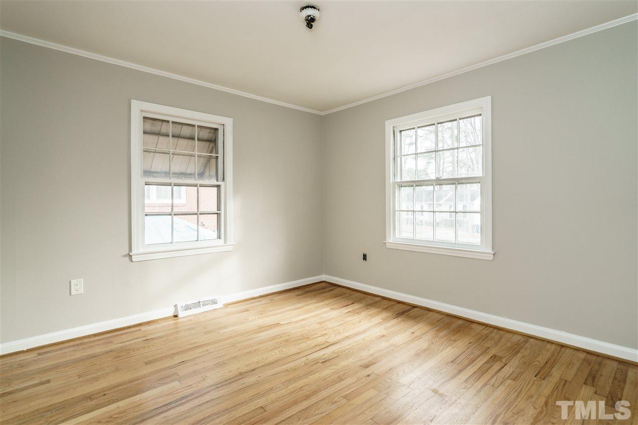 2732 Layden Street Raleigh, NC 27603 - Photo 15 of 19 an empty room with wooden floor and windows