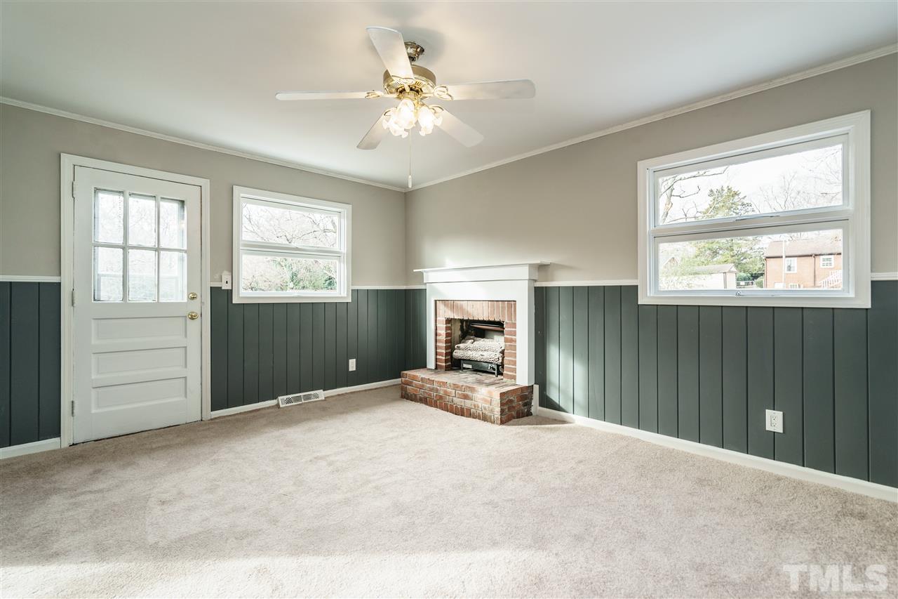 2732 Layden Street Raleigh, NC 27603 - Photo 7 of 19 a view of a livingroom with a chandelier fan