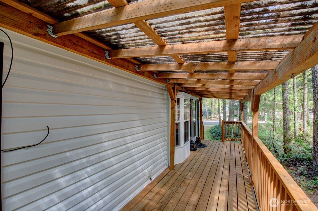 134 Drial Loop Maple Falls, WA 98266 - Photo 20 of 36 a view of a balcony with wooden floor