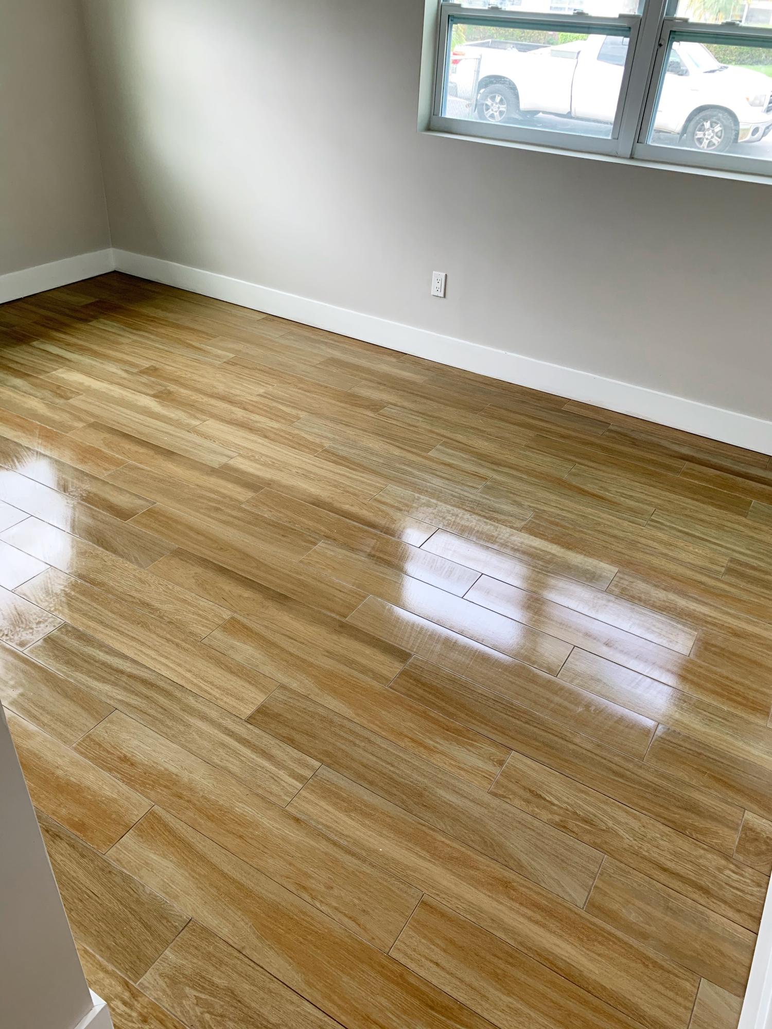22766 Southwest 66th Avenue Boca Raton, FL 33428 - Photo 3 of 10 a view of a room with wooden floor and a window