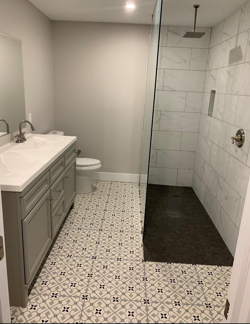 22766 Southwest 66th Avenue Boca Raton, FL 33428 - Photo 8 of 10 a bathroom with a sink a toilet and shower