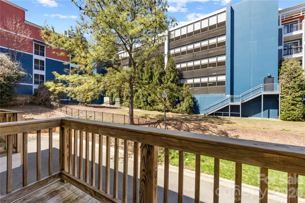 a view of a balcony with a tree