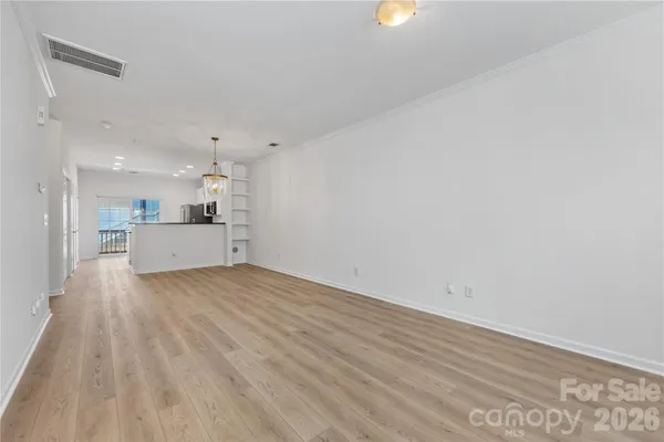 a view of a kitchen with a sink and a window