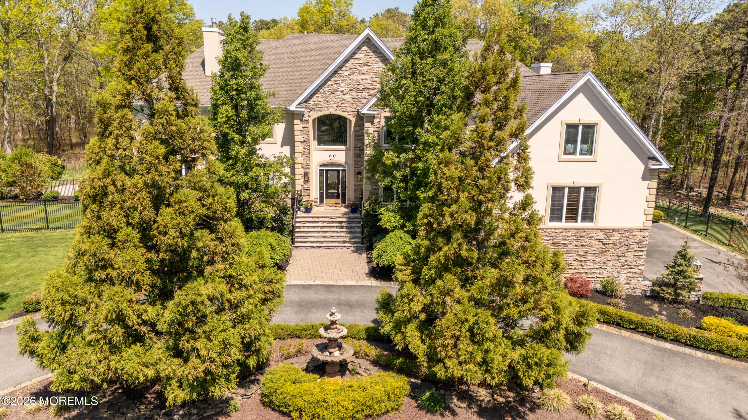 60 Partners Lane Freehold, NJ 07728 - Photo 1 of 56 a front view of a house with a yard and garage