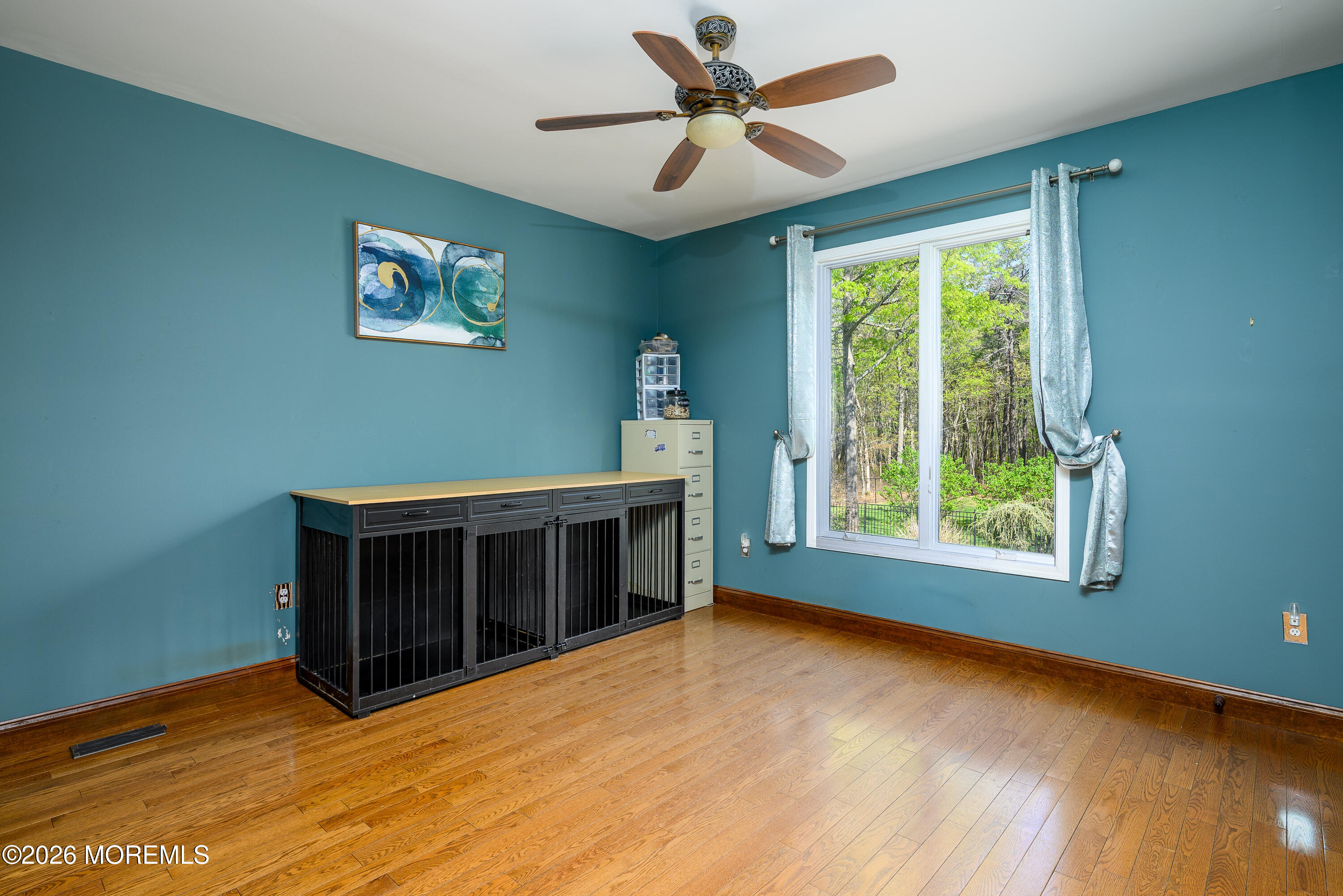 60 Partners Lane Freehold, NJ 07728 - Photo 15 of 56 a view of an empty room with a window and wooden floor