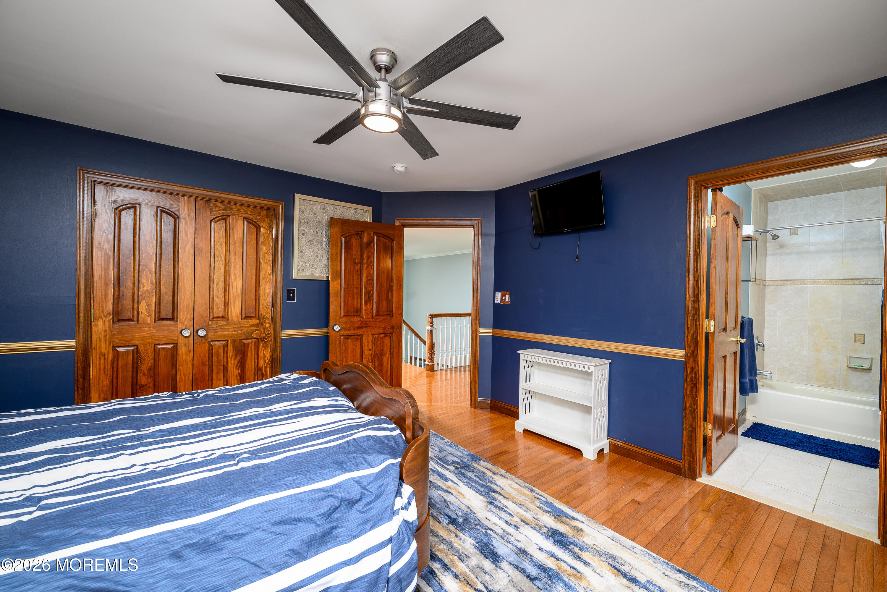 60 Partners Lane Freehold, NJ 07728 - Photo 26 of 56 a bedroom with a bed and a chandelier