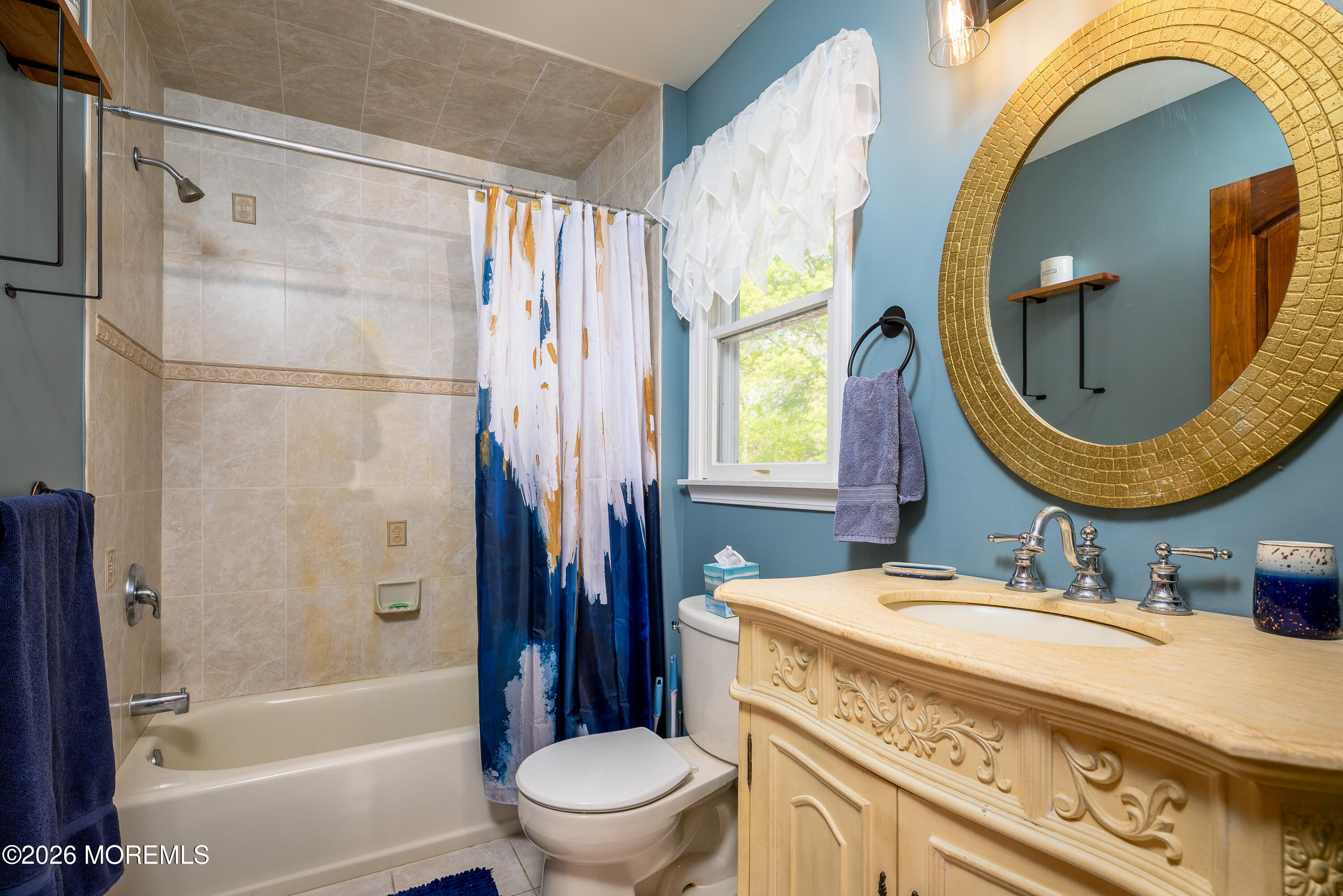 60 Partners Lane Freehold, NJ 07728 - Photo 27 of 56 a bathroom with a sink a toilet and a mirror
