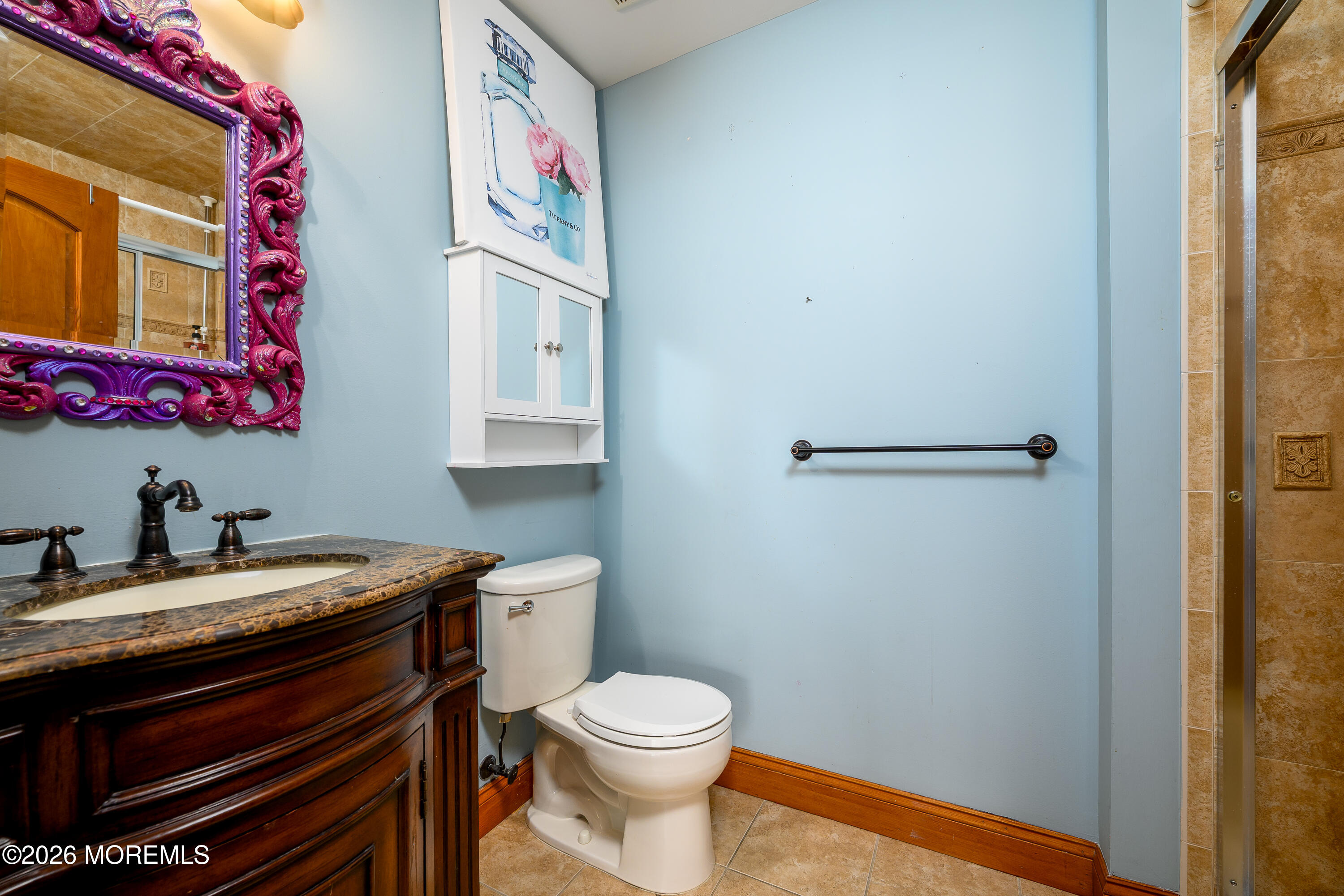 60 Partners Lane Freehold, NJ 07728 - Photo 33 of 56 a bathroom with a toilet a sink and a mirror
