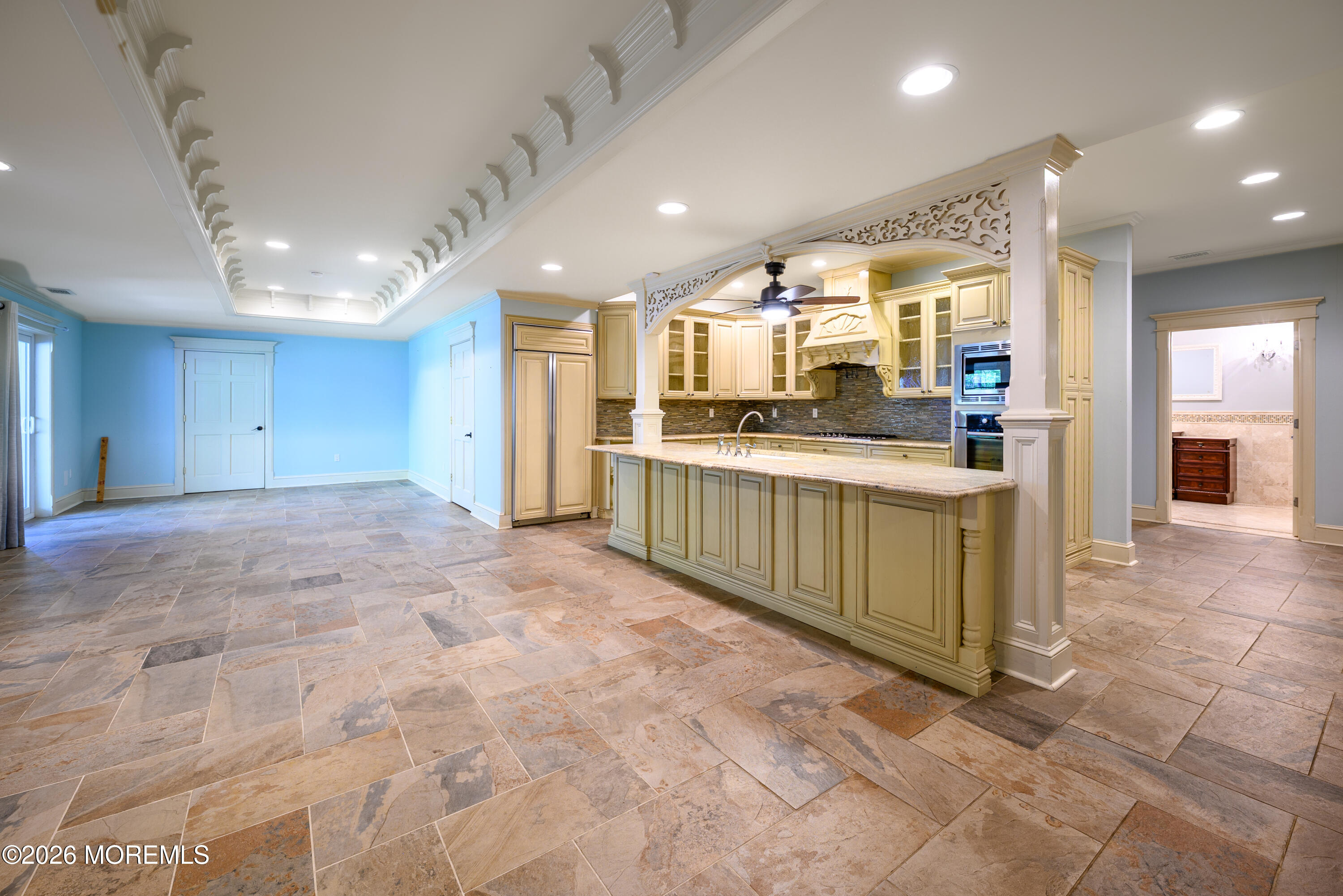 60 Partners Lane Freehold, NJ 07728 - Photo 34 of 56 a large kitchen with stainless steel appliances a large counter top and a view of living room