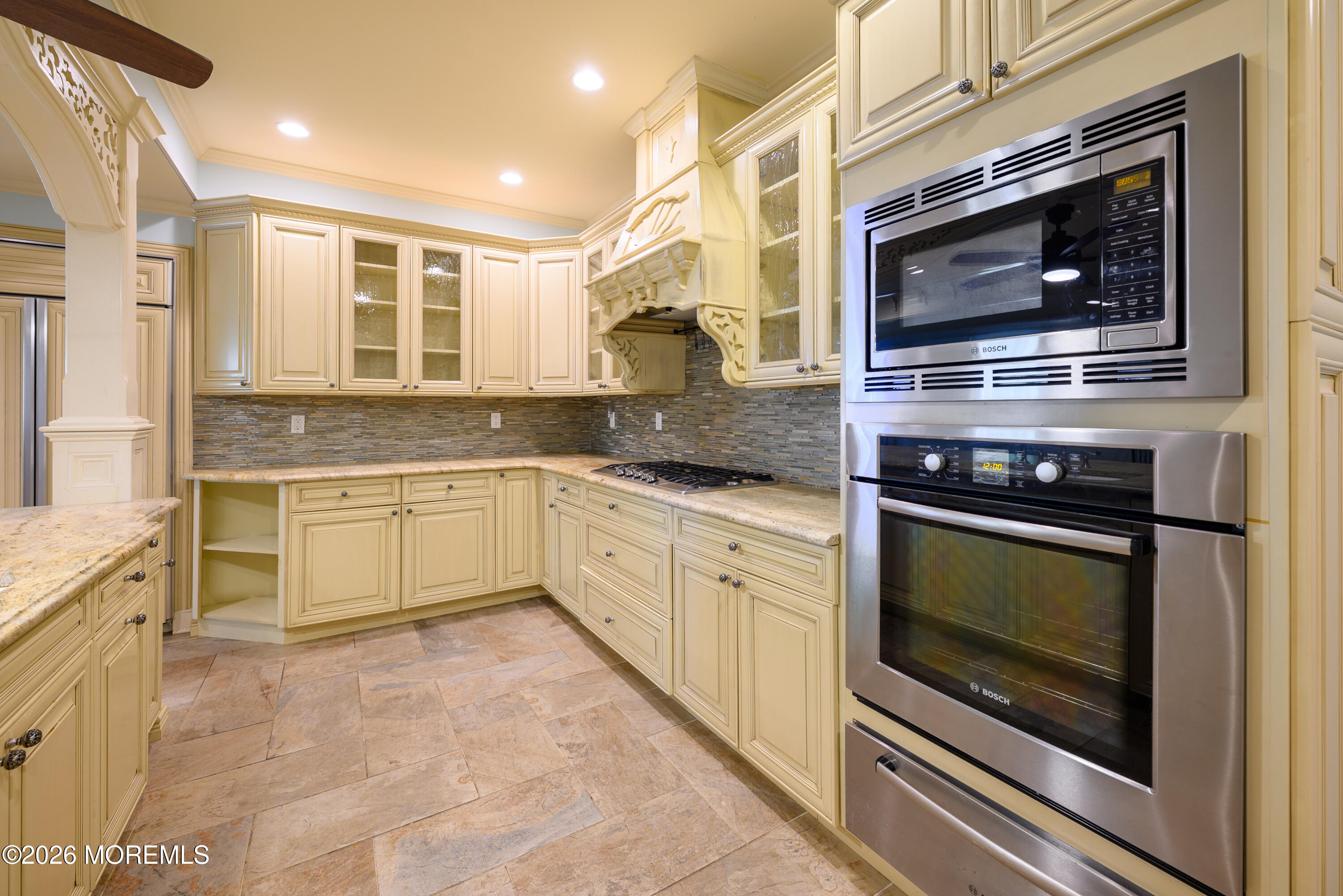 60 Partners Lane Freehold, NJ 07728 - Photo 35 of 56 a kitchen with stainless steel appliances granite countertop a stove and a microwave