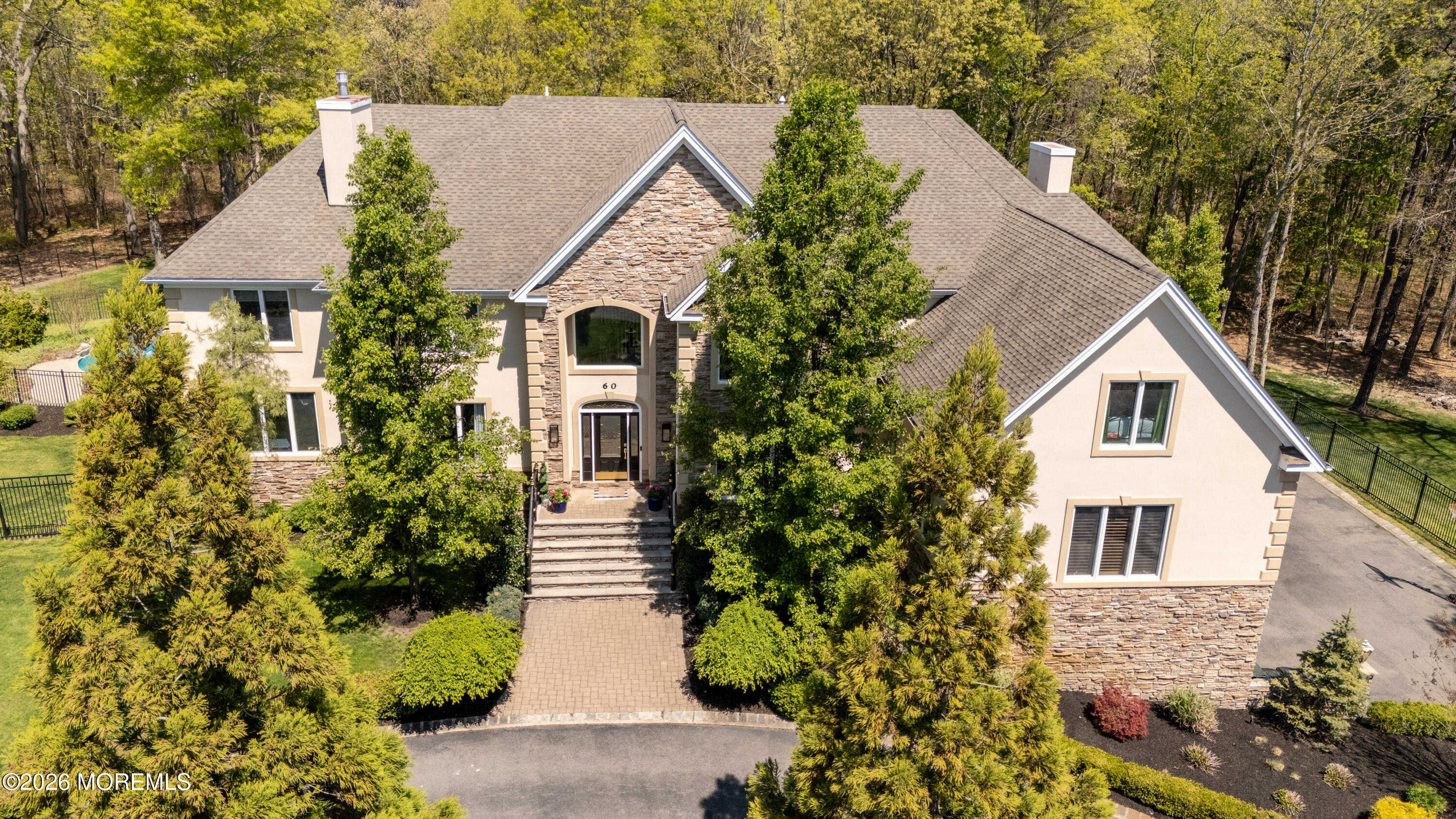 60 Partners Lane Freehold, NJ 07728 - Photo 53 of 56 a aerial view of a house with a yard and potted plants