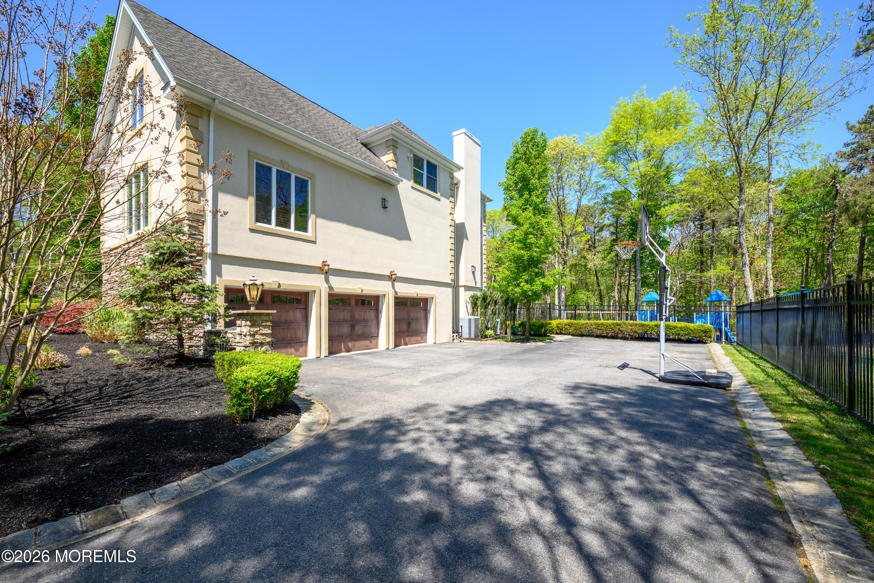 60 Partners Lane Freehold, NJ 07728 - Photo 54 of 56 a front view of a house with a yard and garage
