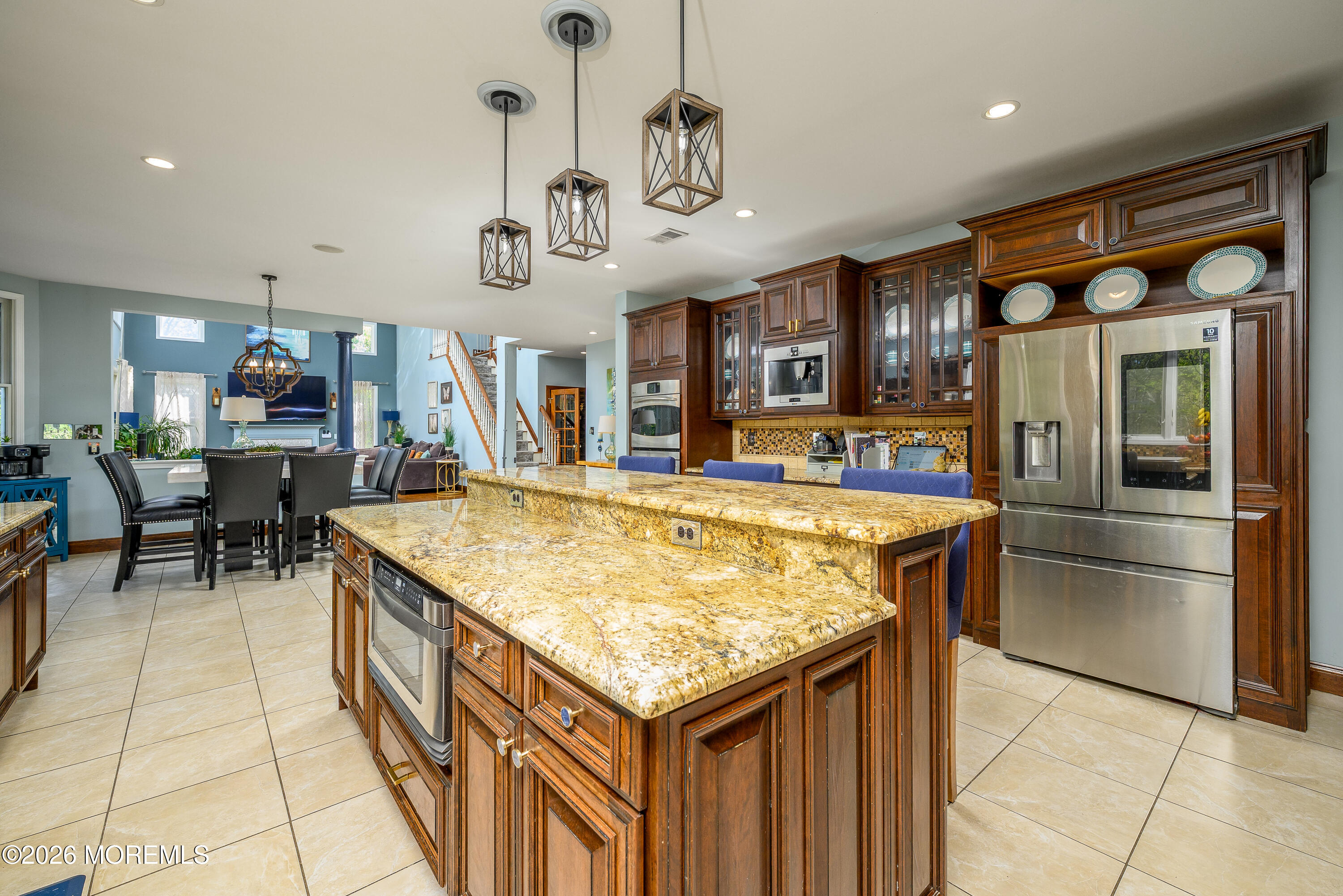 60 Partners Lane Freehold, NJ 07728 - Photo 6 of 56 a kitchen with stainless steel appliances granite countertop a sink and a refrigerator