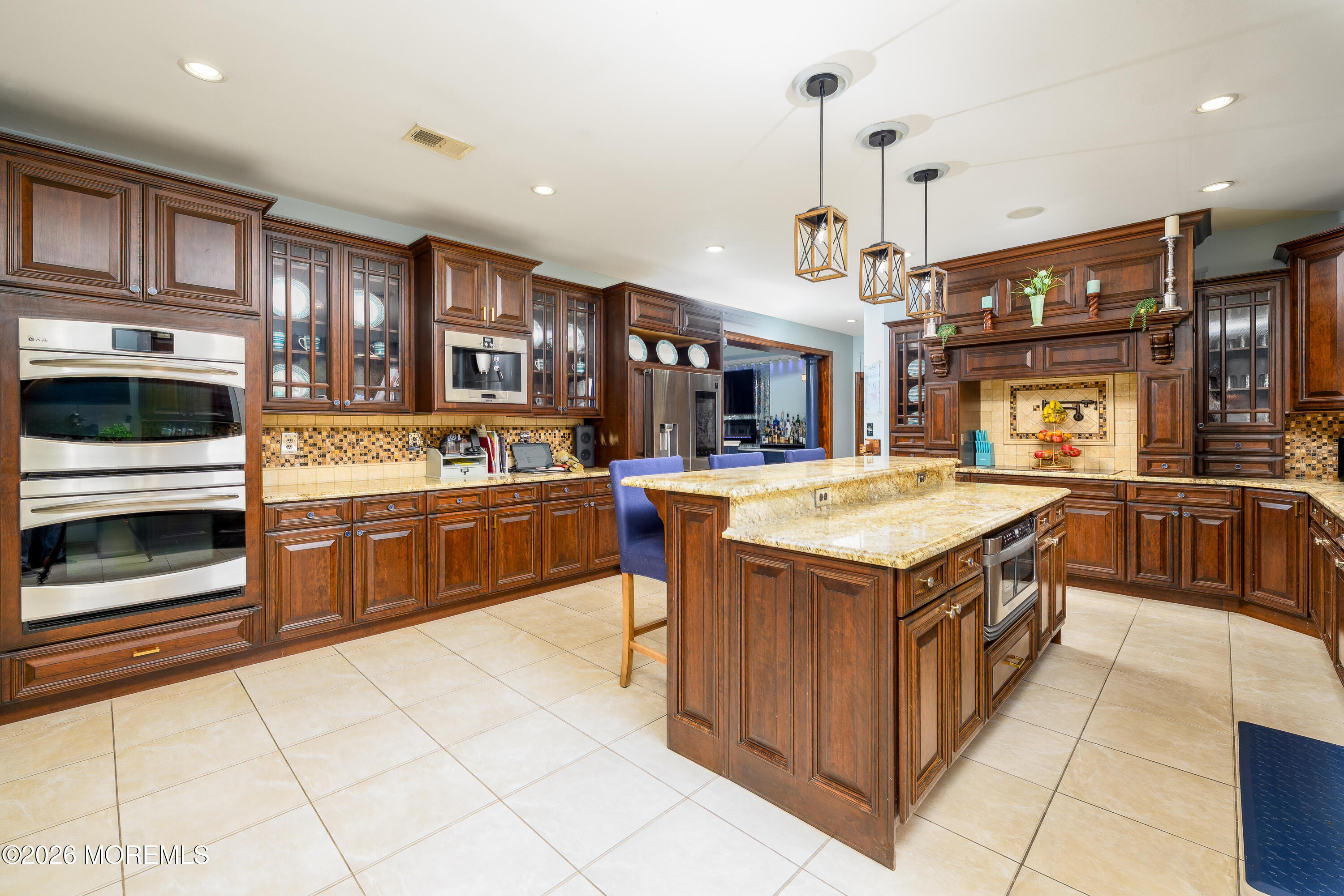 60 Partners Lane Freehold, NJ 07728 - Photo 7 of 56 a kitchen with stainless steel appliances granite countertop a stove and a refrigerator