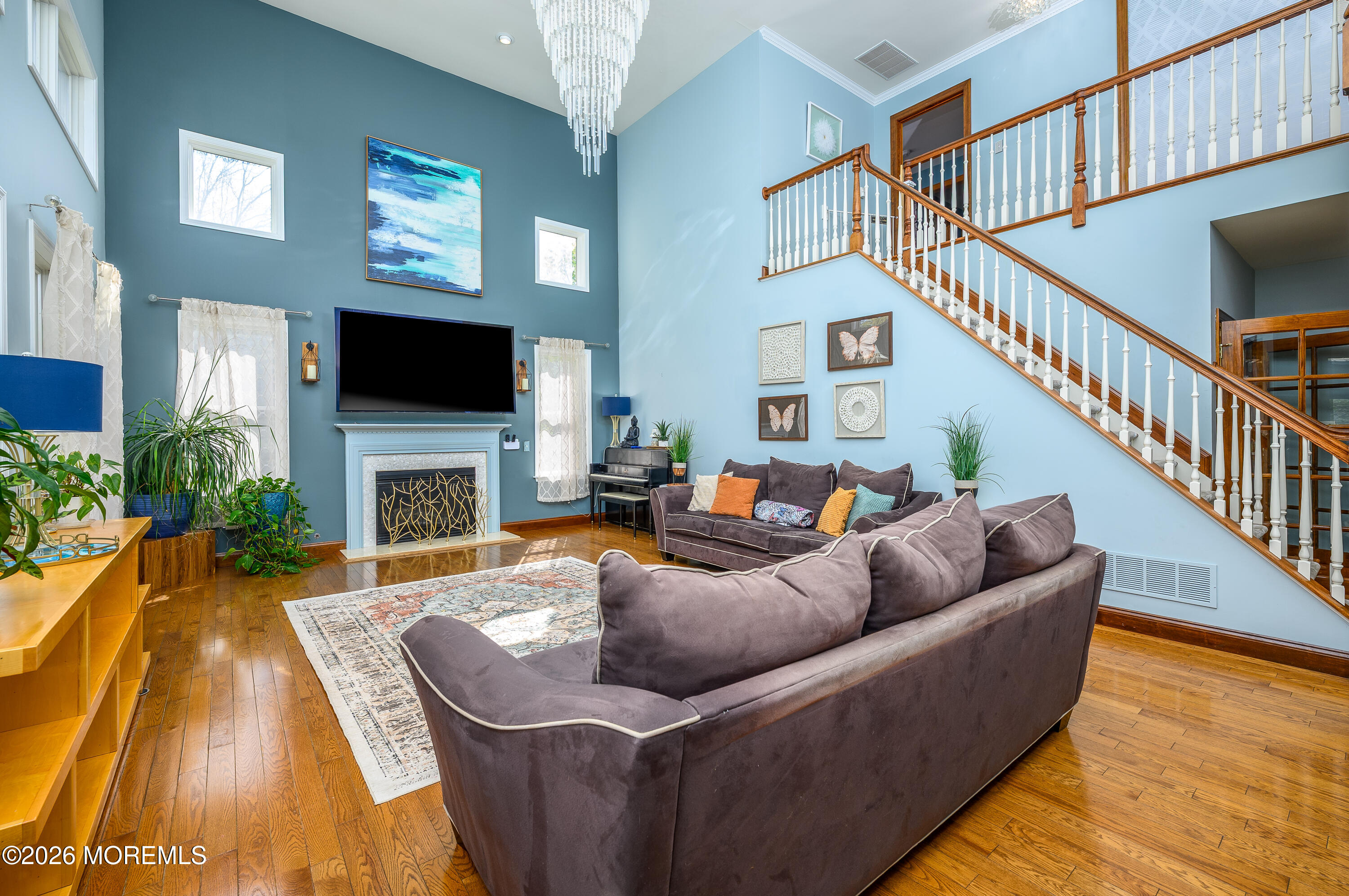 60 Partners Lane Freehold, NJ 07728 - Photo 8 of 56 a living room with fireplace furniture and a flat screen tv