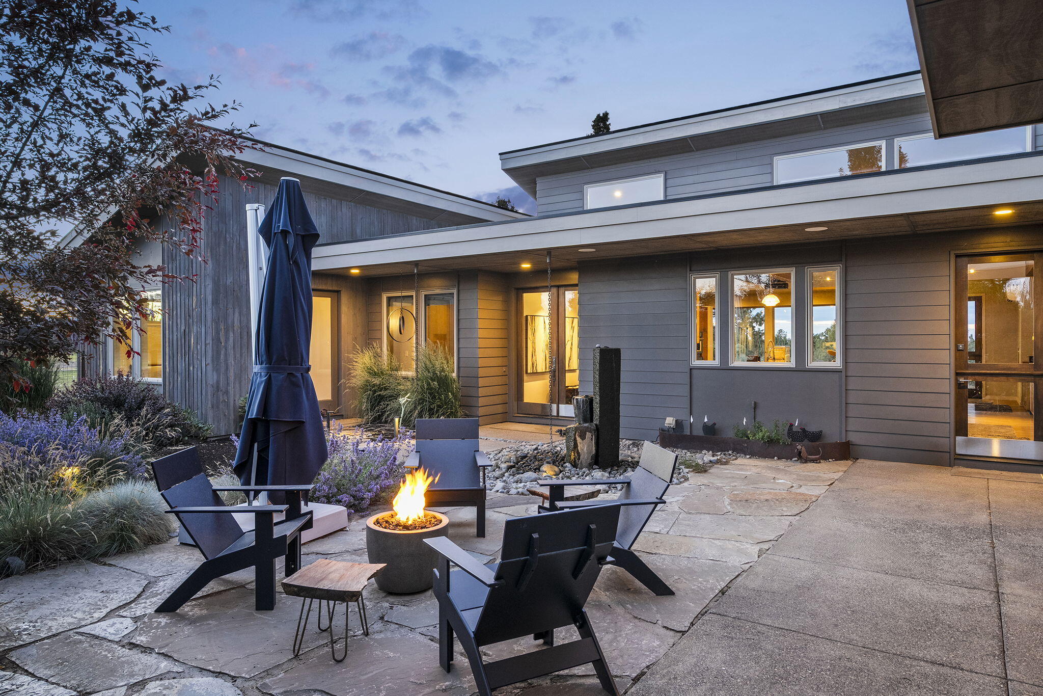 23420 Bear Creek Road Bend, OR 97701 - Photo 5 of 54 Courtyard at Twilight