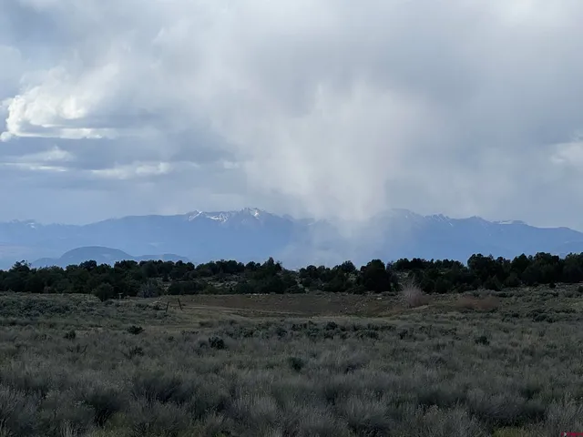 a view of sunset and a mountain