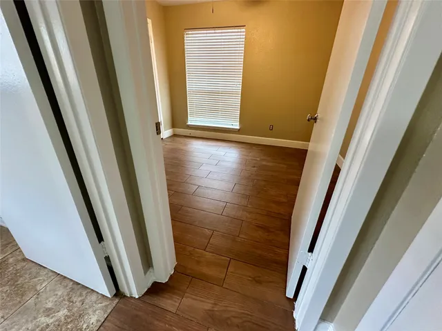 a large bathroom with a tub and a sink