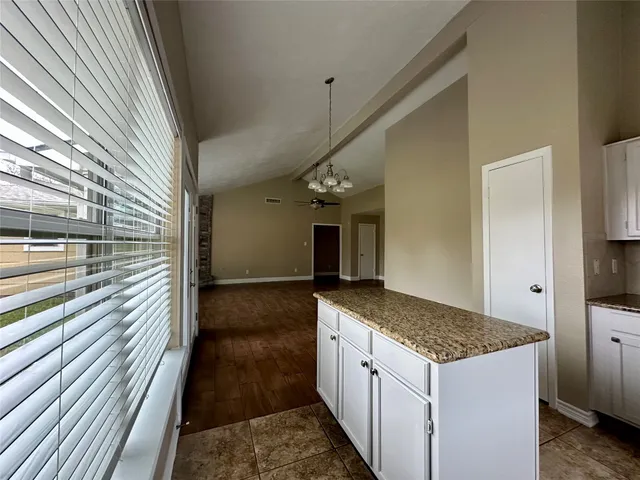 a kitchen with stainless steel appliances granite countertop a sink and cabinets
