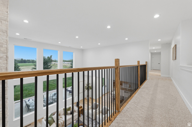 702 Alpine Highway Alpine, UT 84004 - Photo 41 of 83 Open-concept upper-level hallway featuring a light wood railing with black metal spindles and recessed lighting