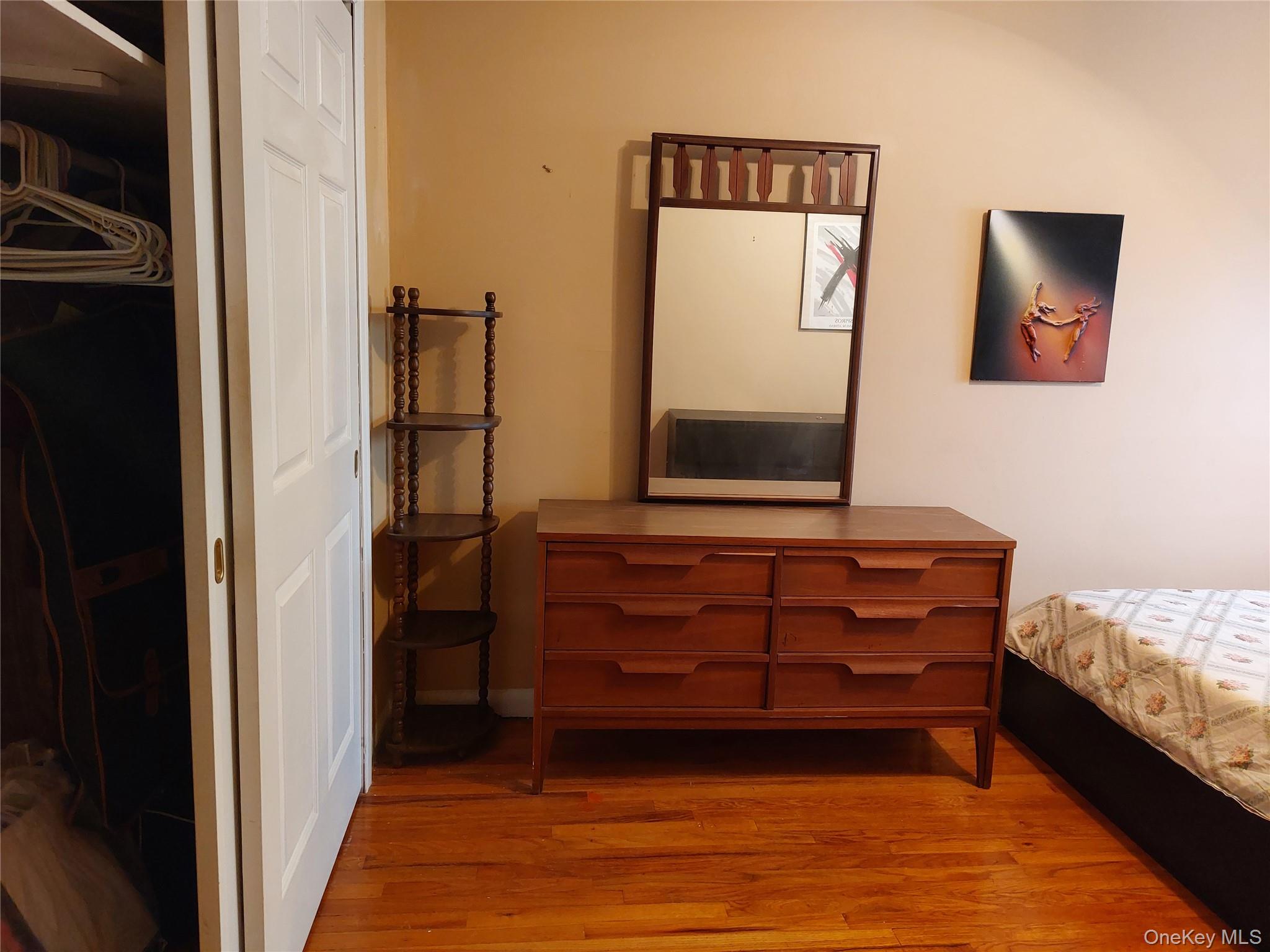 108-19 48th Avenue Queens, NY 11368 - Photo 12 of 21 Bedroom with light wood-style floors