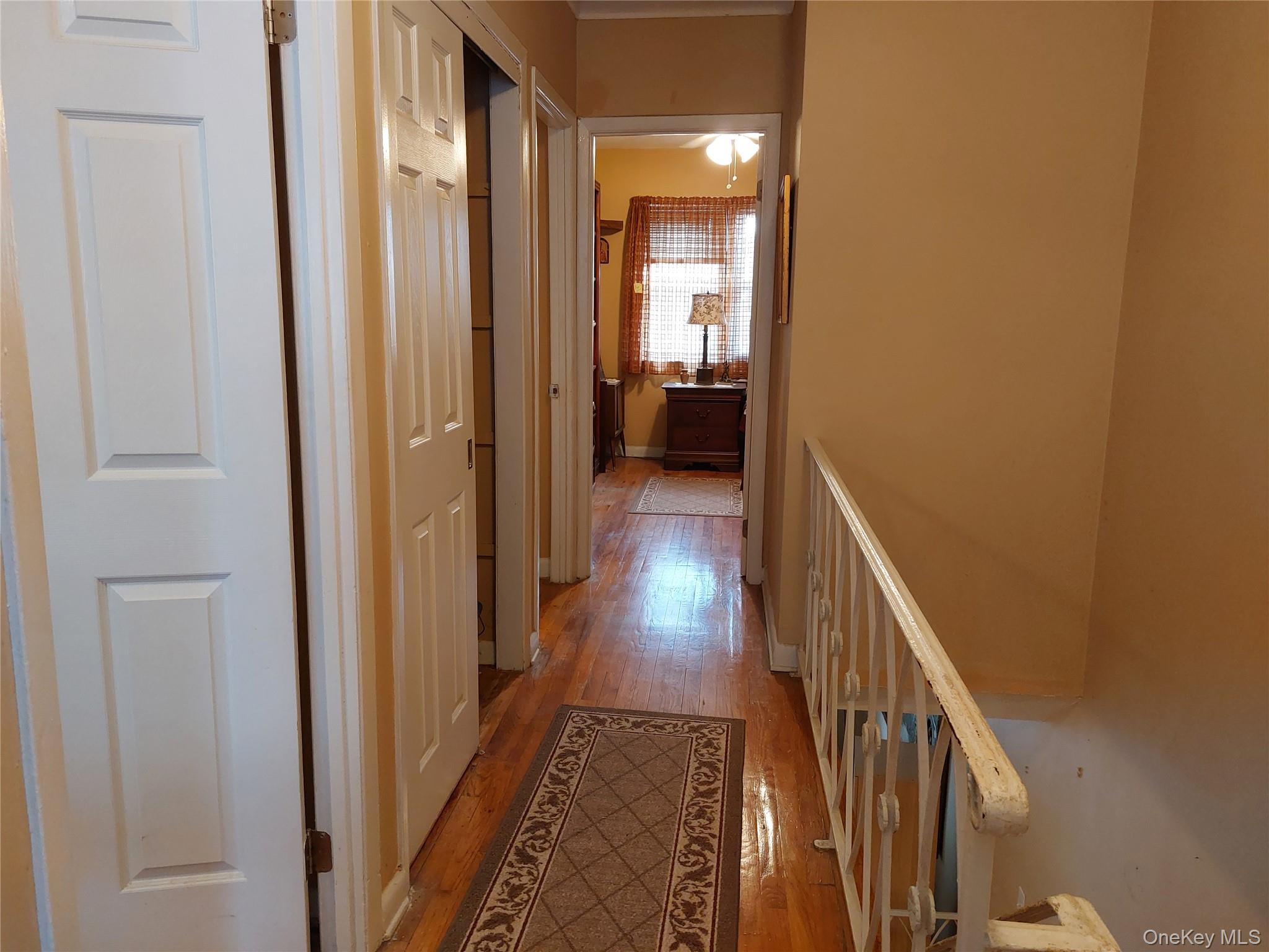 108-19 48th Avenue Queens, NY 11368 - Photo 14 of 21 Corridor with light wood-style flooring and ornamental molding