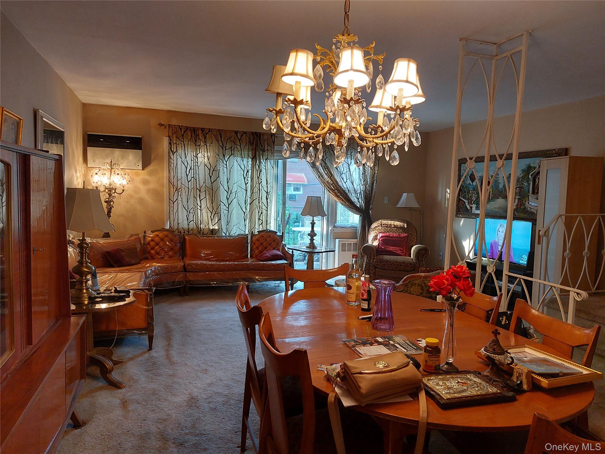 108-19 48th Avenue Queens, NY 11368 - Photo 2 of 21 Dining room with a chandelier and carpet