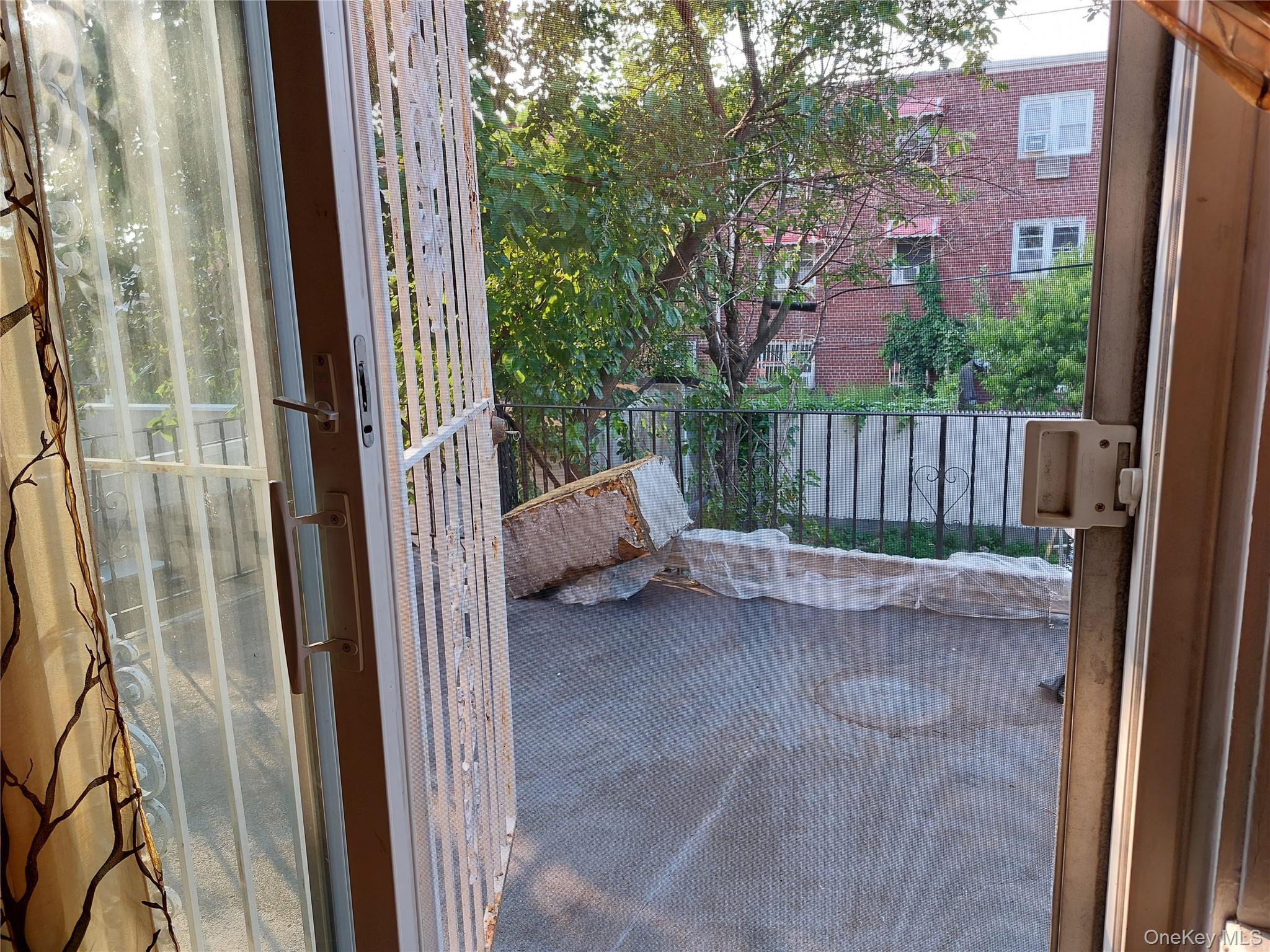 108-19 48th Avenue Queens, NY 11368 - Photo 4 of 21 Terrace on the back opening from the Livingroom on the 2nd floor.