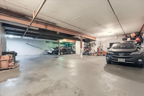 a view of parking garage with cars