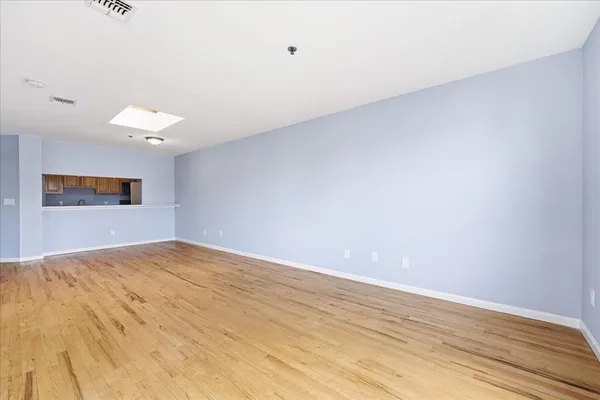 a view of an empty room and window