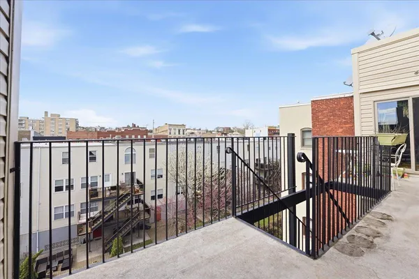 a view of a balcony with city view