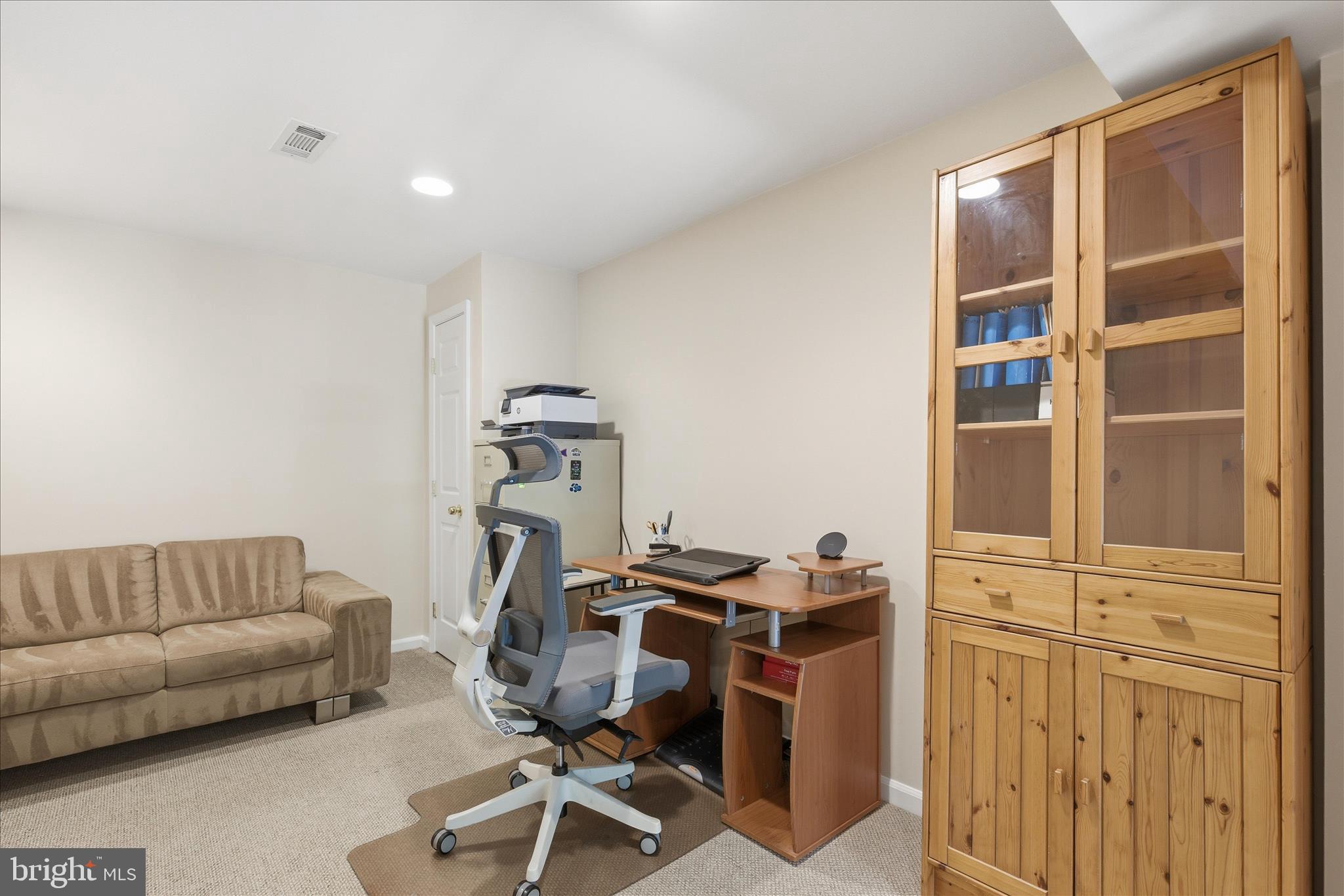 1943 Hickory Hill Lane Silver Spring, MD 20906 - Photo 26 of 54 a livingroom with workspace and a couch