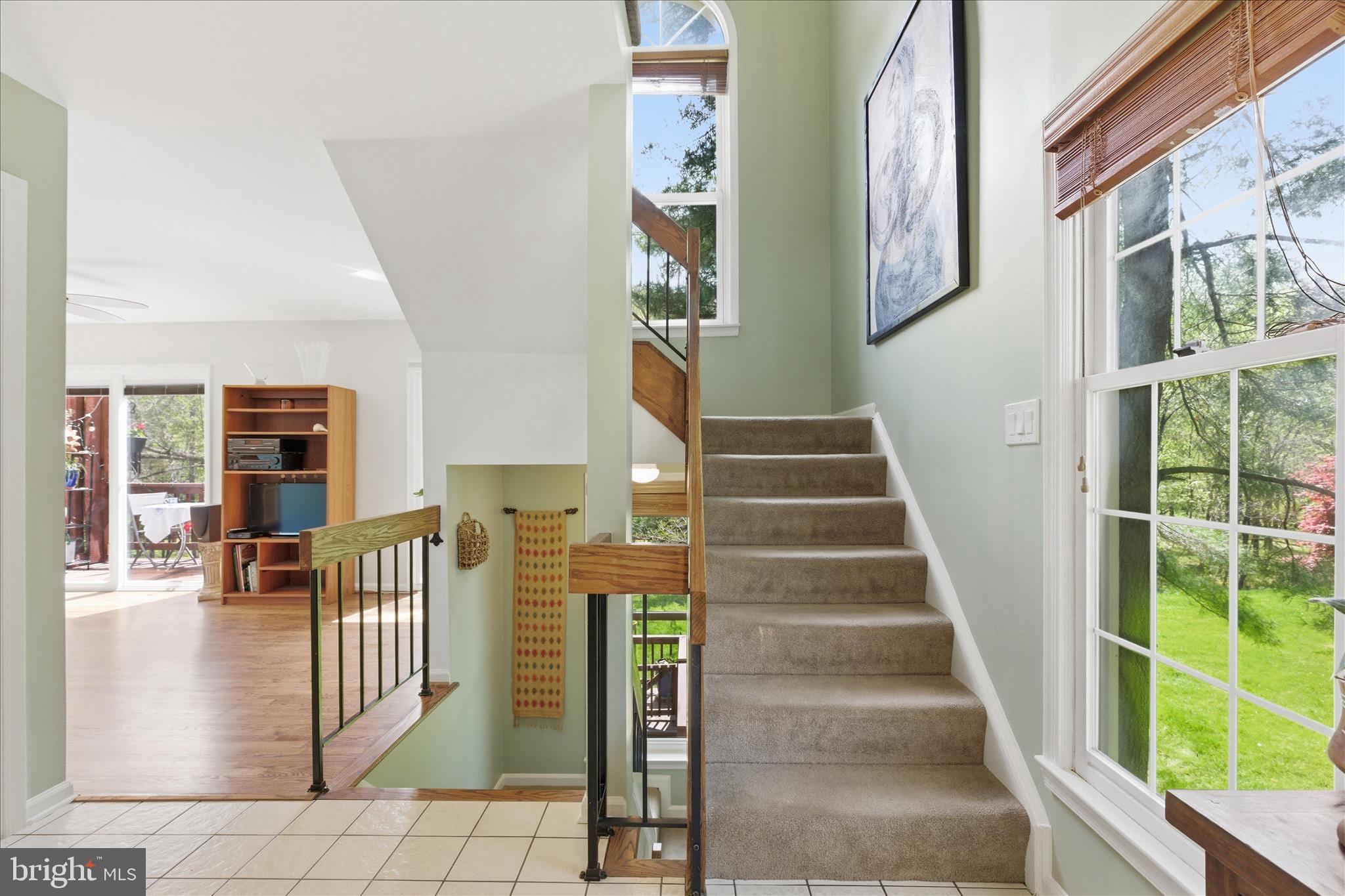 1943 Hickory Hill Lane Silver Spring, MD 20906 - Photo 27 of 54 a view of staircase with lots of frames on wall and a potted plant