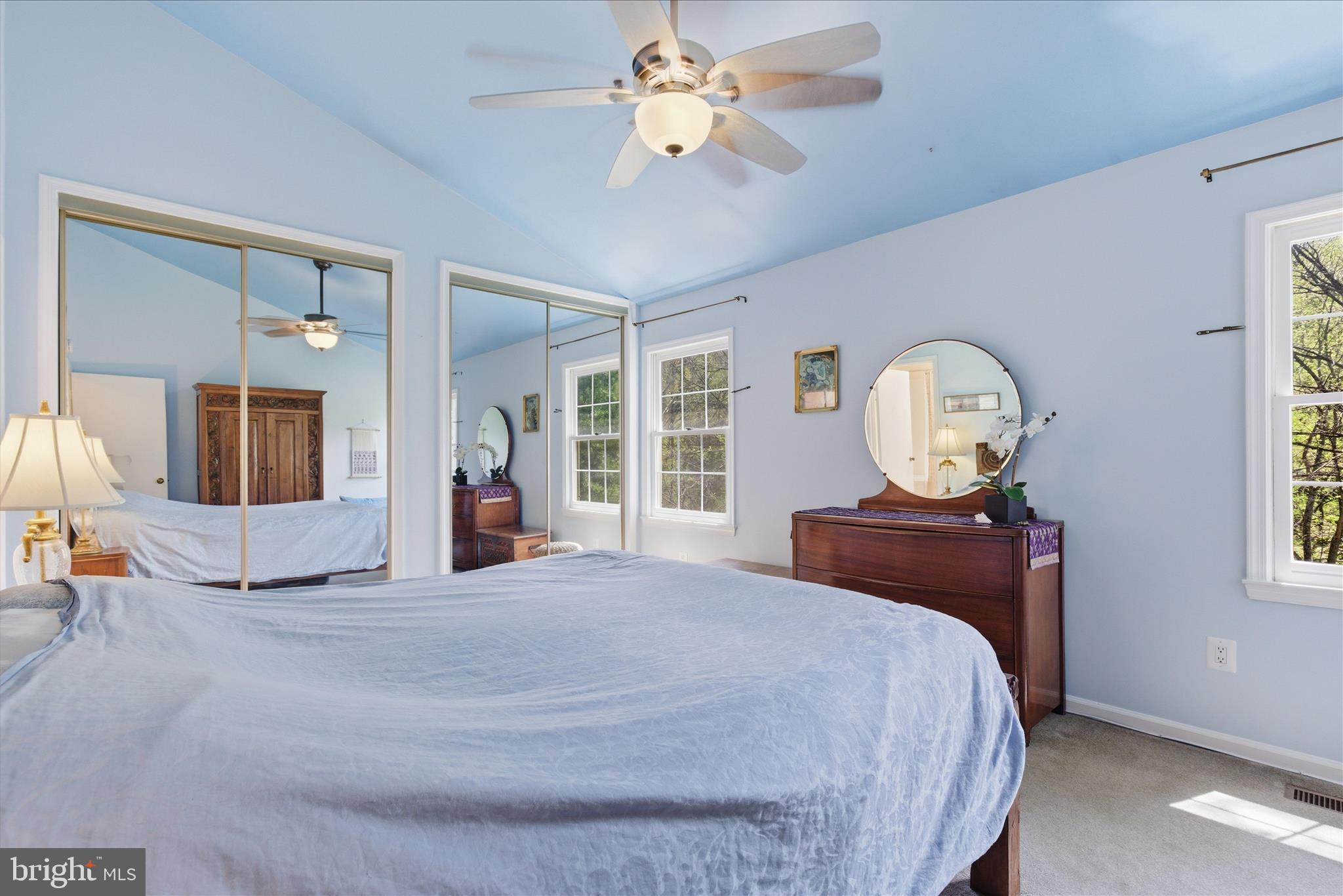 1943 Hickory Hill Lane Silver Spring, MD 20906 - Photo 29 of 54 a bedroom with a large bed and a chandelier
