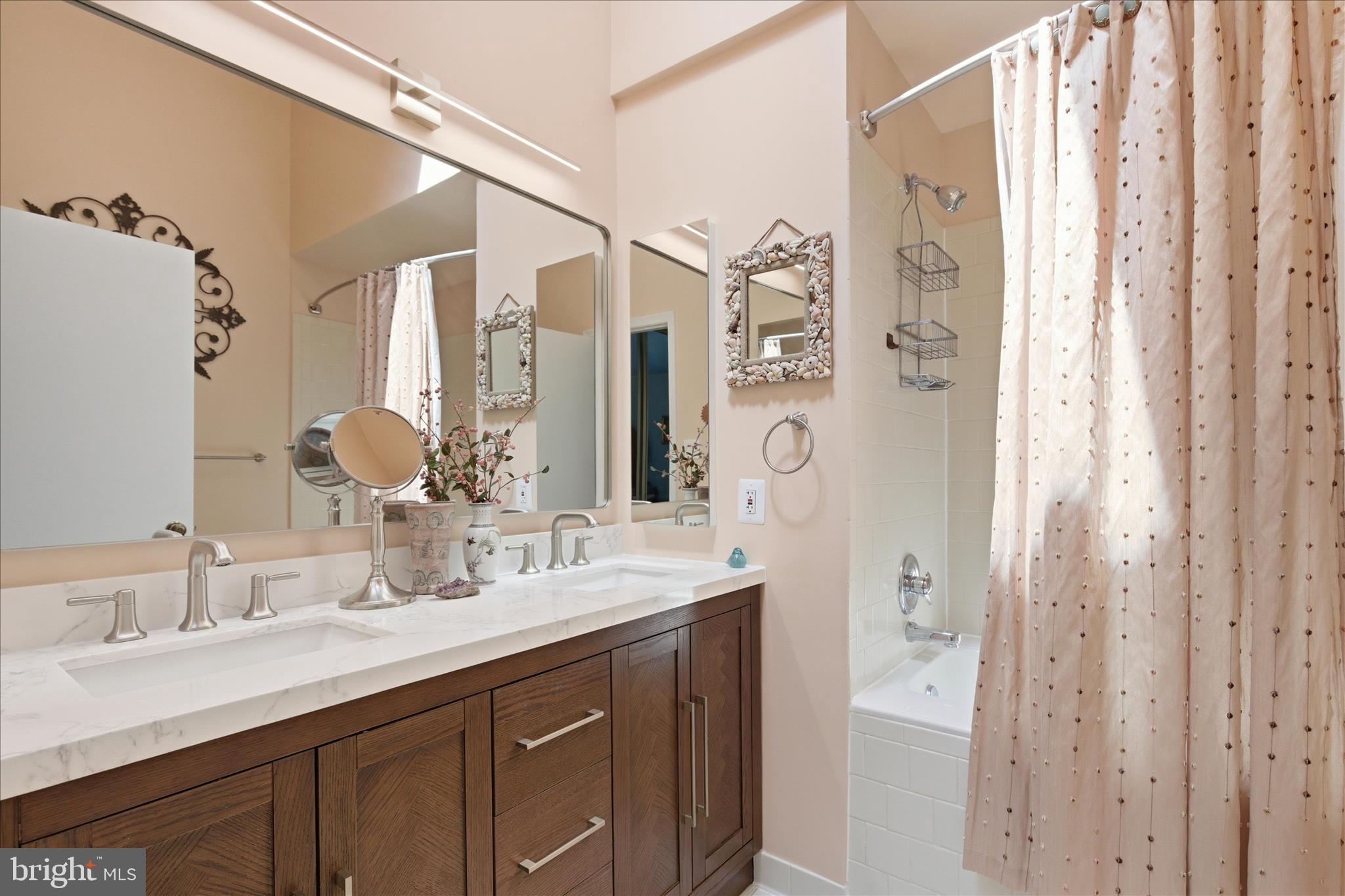 1943 Hickory Hill Lane Silver Spring, MD 20906 - Photo 32 of 54 a bathroom with a double vanity sink mirror and double