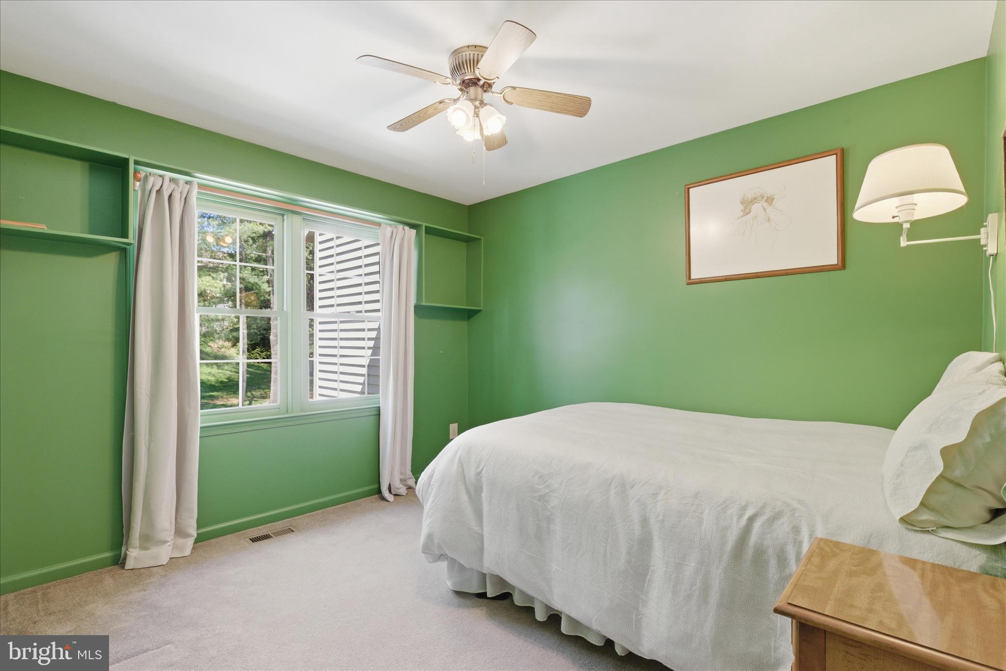 1943 Hickory Hill Lane Silver Spring, MD 20906 - Photo 34 of 54 a bedroom with a bed and a window