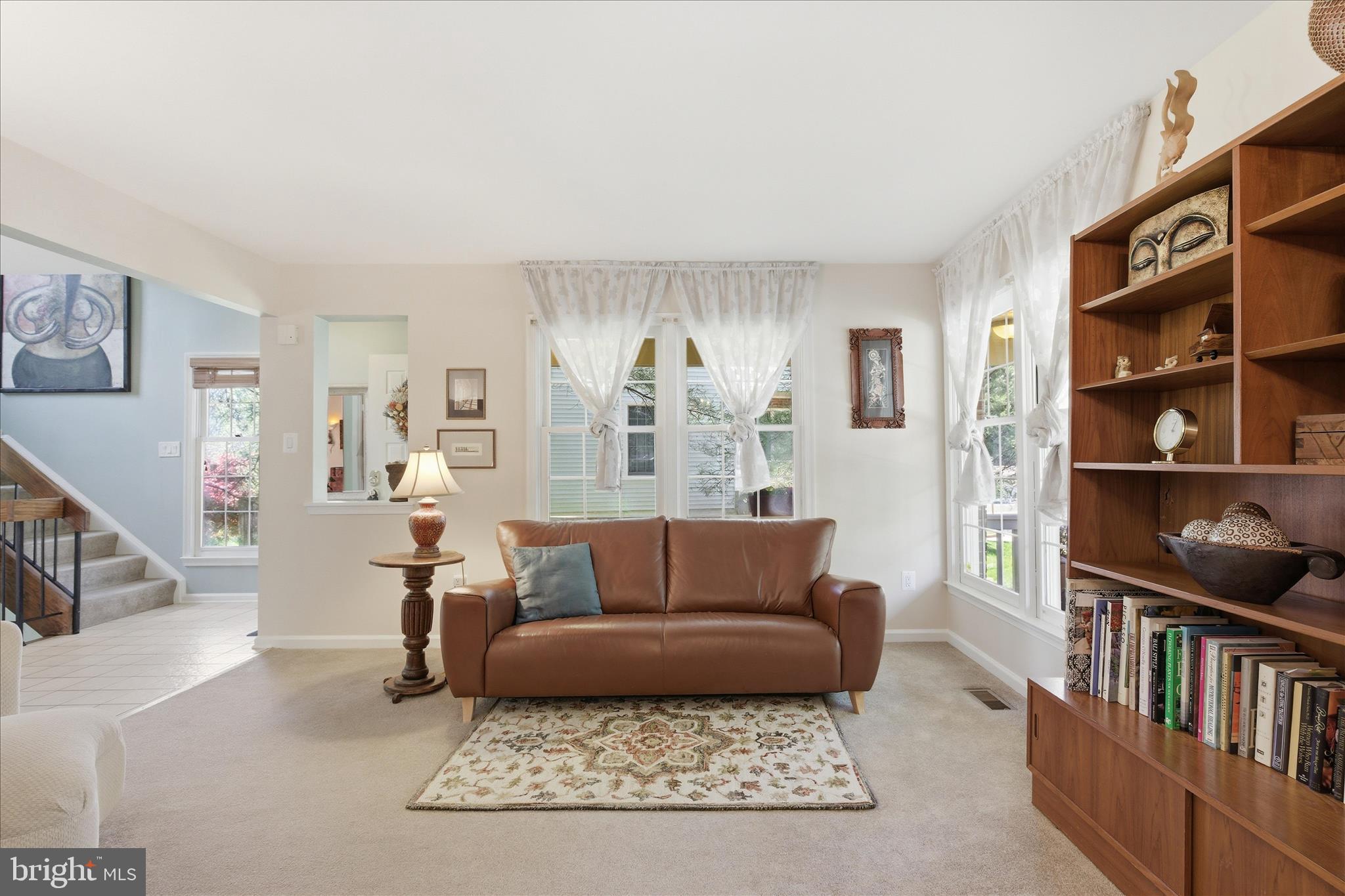 1943 Hickory Hill Lane Silver Spring, MD 20906 - Photo 10 of 54 a living room with furniture and a book shelf