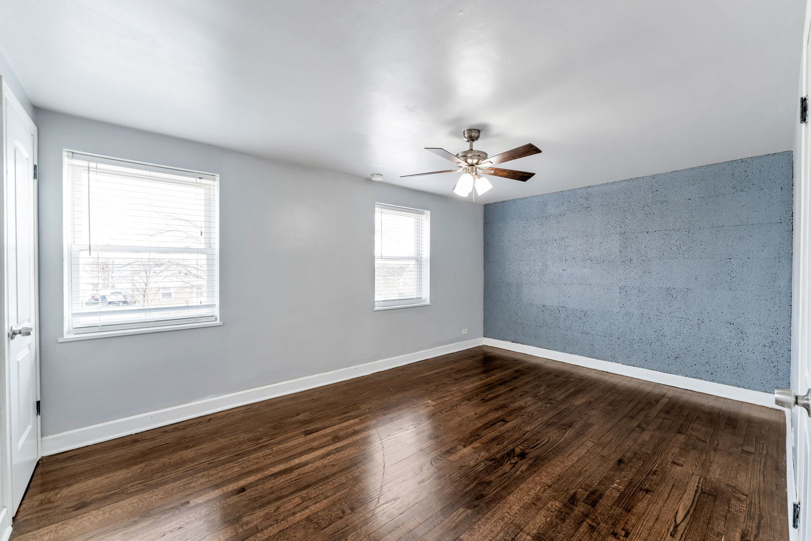 3142 54th Court Cicero, IL 60804 - Photo 6 of 15 wooden floor in an empty room with a window