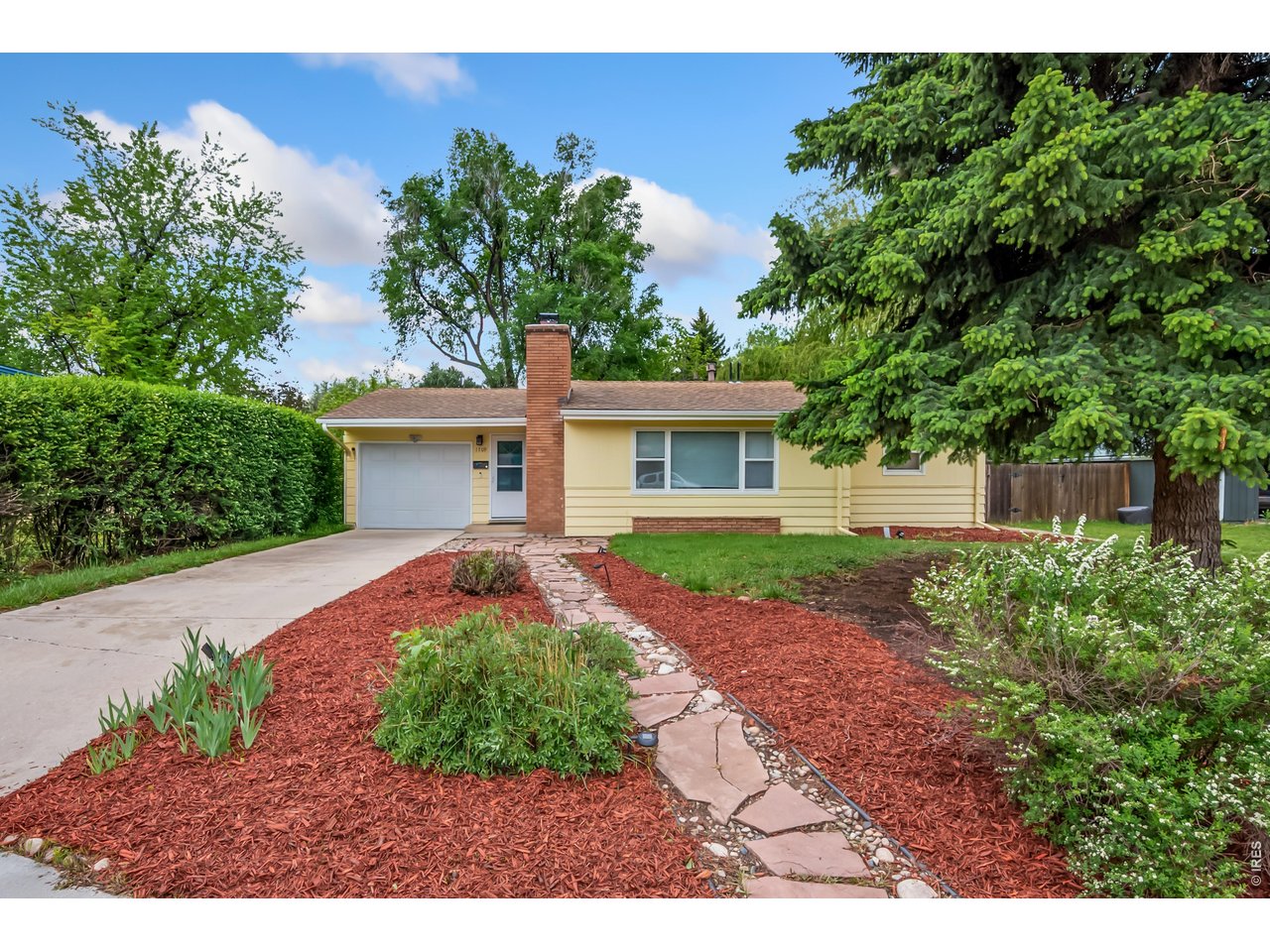 1709 Dale Court Fort Collins, CO 80521 - Photo 1 of 26 a front view of a house with garden