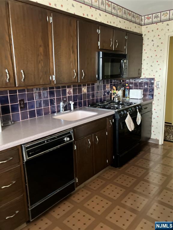 280 Prospect Avenue, Unit 11H Hackensack, NJ 07601 - Photo 7 of 20 a kitchen with a sink and a stove